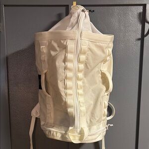 The North Face White Backpack with Sturdy Canvas and Top Handle